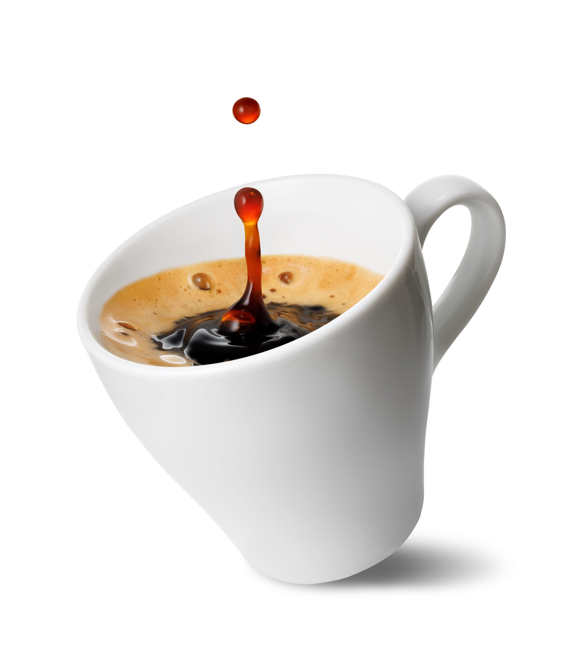 Small inclined espresso cup with freshly brewed coffee with splash and drop, isolated on white background